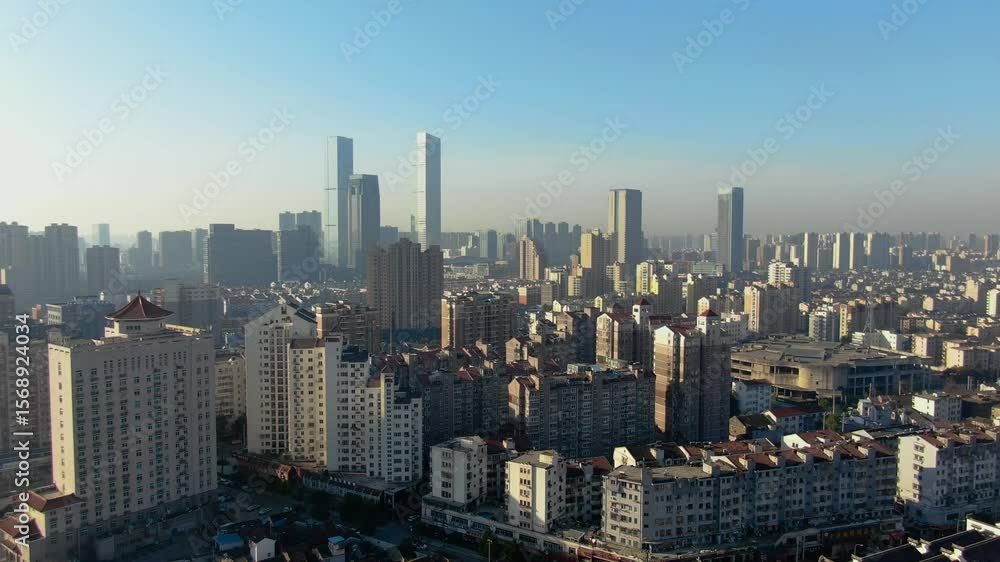 Urban landscape of Wuxi showcases dense architecture and modern skyscrapers in perfect daylight Urban landscape of Wuxi showcases dense architecture and modern skyscrapers in perfect daylight