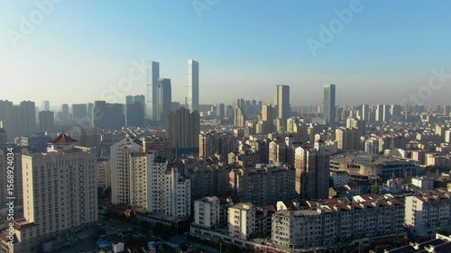 Urban landscape of Wuxi showcases dense architecture and modern skyscrapers in perfect daylight