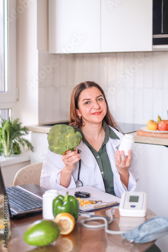 nutritionist doctor shows broccoli and dietary supplements as part of a healthy diet for women. fitness and diet concept.