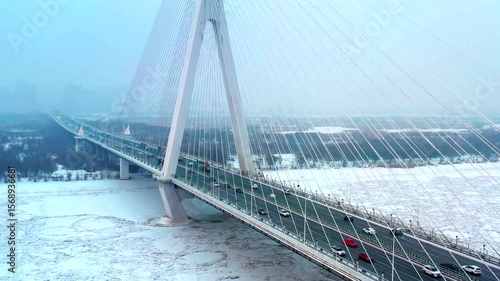 Aerial view of Mudanjiang Bridge showcasing winter landscape in Harbin Heilongjiang during snowy conditions