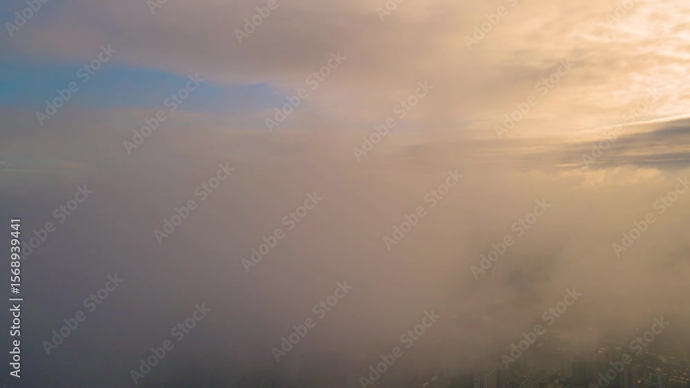 Discovering the stunning skyline of Guangzhou city hidden beneath a blanket of clouds during sunrise Discovering the stunning skyline of Guangzhou city hidden beneath a blanket of clouds during sunrise