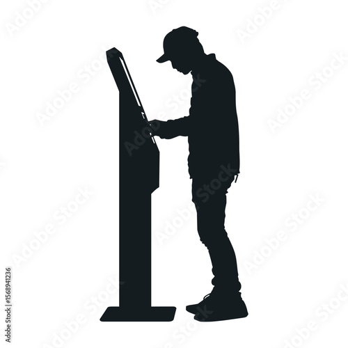 Silhouette of Man Interacting with Digital Kiosk