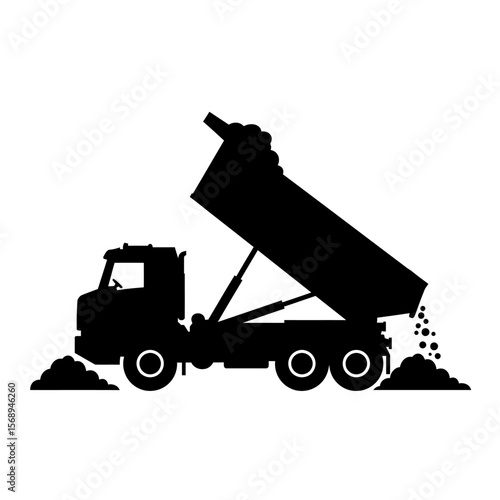 Silhouette of a dump truck unloading its cargo onto the ground.