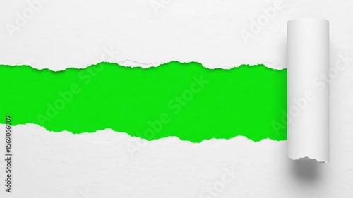 A sheet of white paper is torn open to reveal a vibrant green screen background