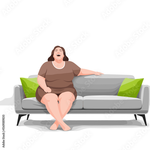 Plus size woman laughing while sitting on a modern sofa at home  