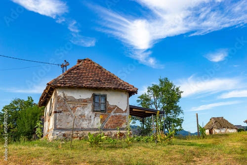 Old rural house in Serbia. Traditional Balkan countryside architecture.