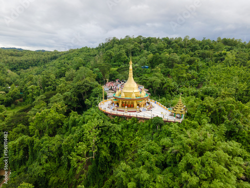 Buddhist Architecture Surrounded by Lush Green Hills. Aerial View of Golden Temple in Bandarban, Bangladesh