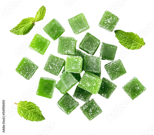 Delicious green cannabis-infused gummies scattered attractively on a sleek black surface