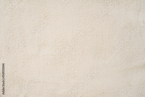 Beige plastered wall texture background. Plain light beige wall with soft plaster texture, minimal surface relief. Concept of simplicity, neutrality, architectural natural background