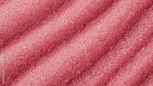 Texture of pink sugar granules close-up background vibrant sweet desse