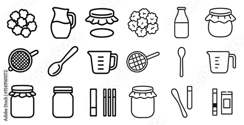 Collection of kitchen utensils and jars. The jars are of various sizes and shapes, and the utensils include spoons, cups, and a pitcher. Concept of organization and preparation for cooking or baking
