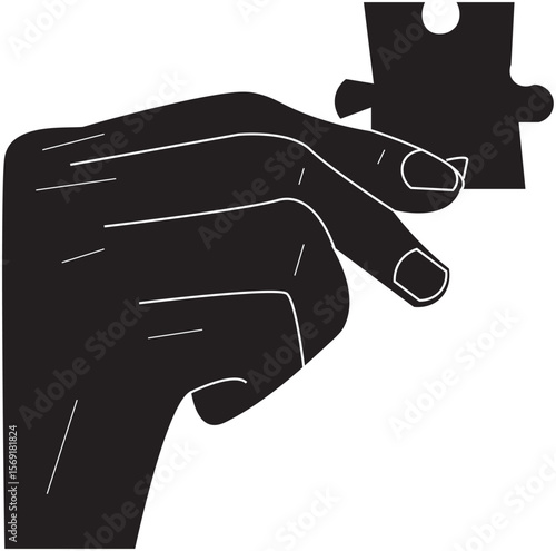 The Shillouette of hand holding a piece of puzzle