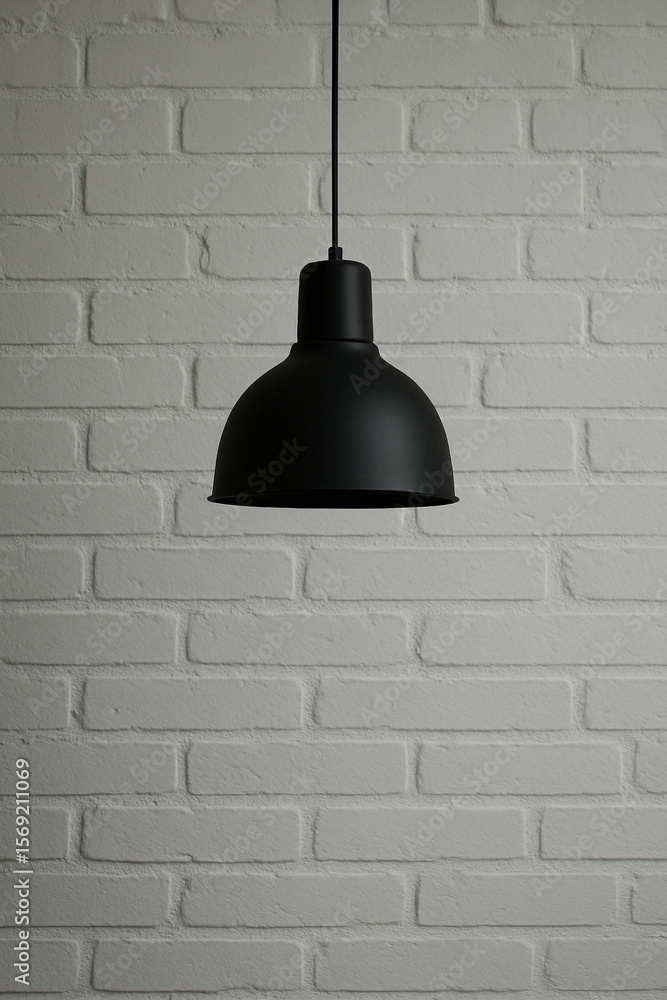 Obraz premium Vintage industrial lamp mounted on whitewashed brick wall