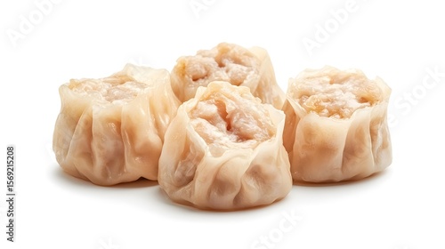 Photograph of shumai, steamed dumplings on a white background, displaying pleated texture.