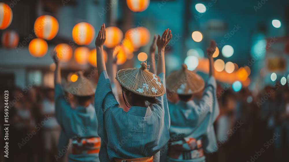 Obraz premium Awa Odori Festival Night Parade with Dancers in Yukata and Traditional Hats Performing in Japanese Summer Festival Street Scene