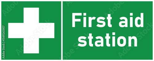 first aid station sign and symbol in green and white landscape format