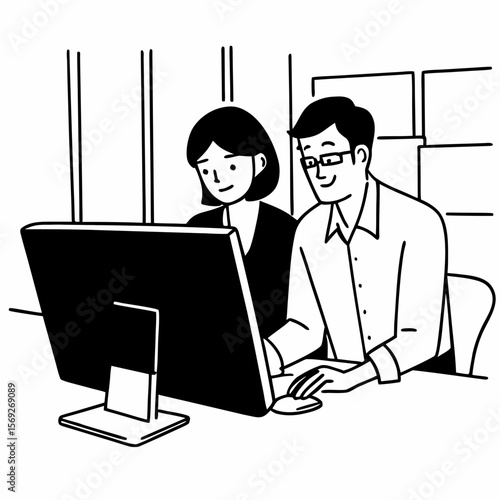 Two corporate professionals working together on computer