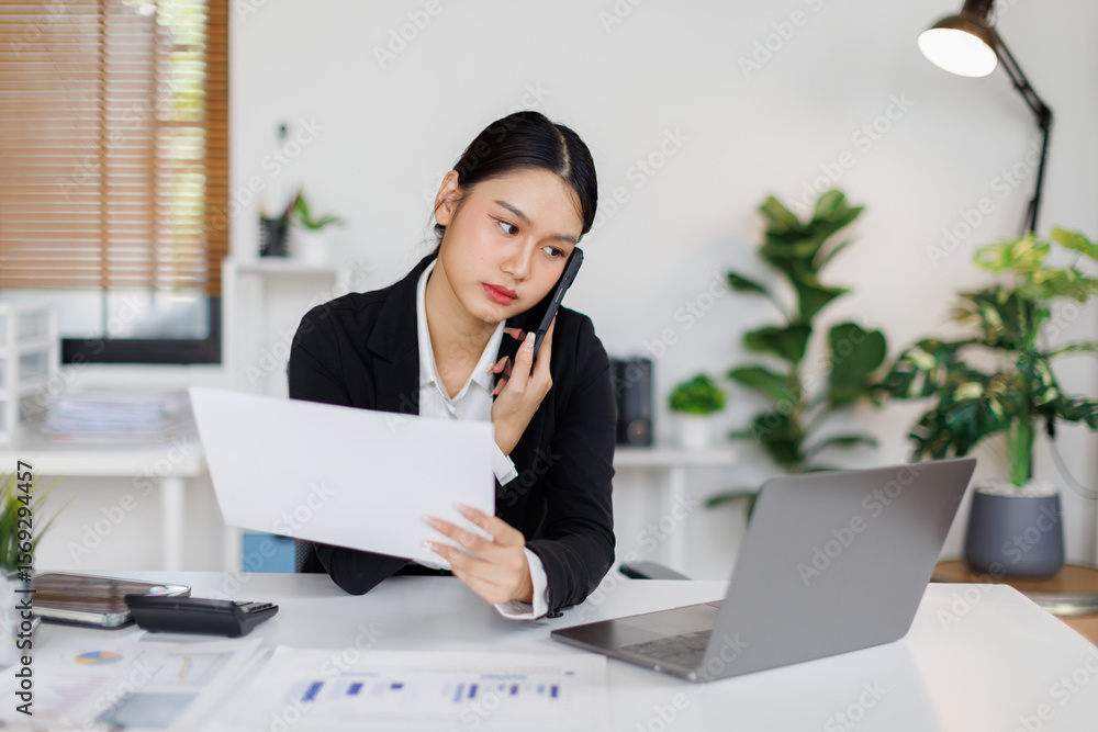 Cheerful young business asian woman freelancer making telephone call share good news about project working in office workplace, business finance concept. Cheerful young business asian woman freelancer making telephone call share good news about project working in office workplace, business finance concept.