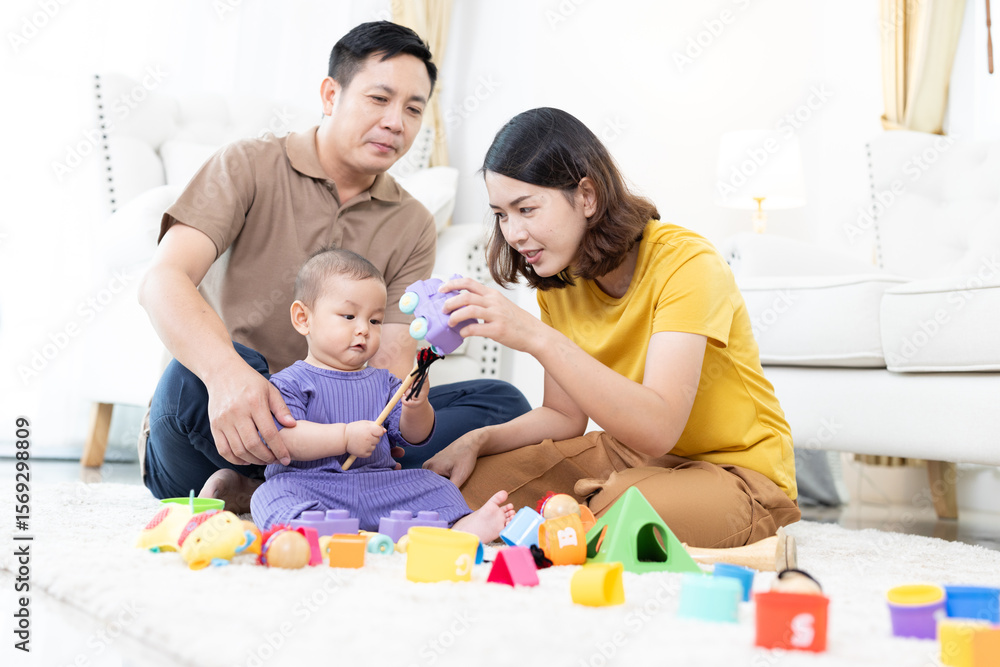 Asian family mother,father ,son playing with colorful kid toys. Happy baby boy in kindergarten or daycare. Child playing with colorful educational toys in preschool. Asian woman. Happy family. Asian family mother,father ,son playing with colorful kid toys. Happy baby boy in kindergarten or daycare. Child playing with colorful educational toys in preschool. Asian woman. Happy family.