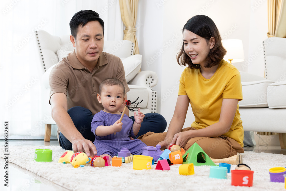 Asian family mother,father ,son playing with colorful kid toys. Happy baby boy in kindergarten or daycare. Child playing with colorful educational toys in preschool. Asian woman. Happy family. Asian family mother,father ,son playing with colorful kid toys. Happy baby boy in kindergarten or daycare. Child playing with colorful educational toys in preschool. Asian woman. Happy family.