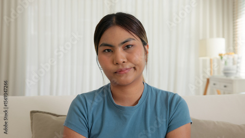 Quadro su tela POV device screen young adult Gen Z asia people woman look at camera upset doubt face tired in mid life crisis mental health illness