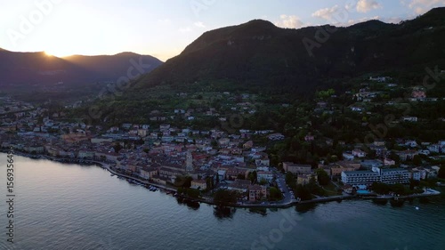 Europe, Italy, Brescia , Garda lake , Salo' drone aerial view of village with church and lake with blue water - Italian Republic from 1943 to 1945 during the reign of Benito Mussolini fascist