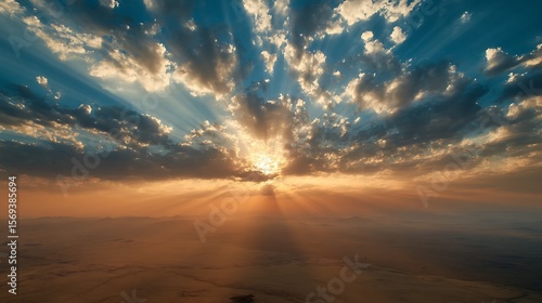 Sunrise over the vast land with dramatic light and shadows / 大地に広がる朝日の光と影のドラマ