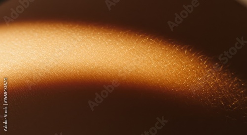 Close-Up of Smooth Human Skin with Warm Golden Lighting
