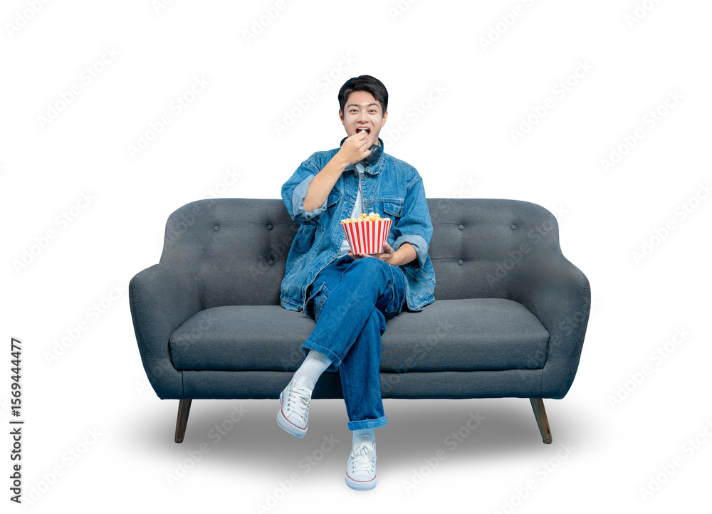 A surprised or amused young man eats popcorn while watching an entertaining show, sitting on a couch.
PNG A surprised or amused young man eats popcorn while watching an entertaining show, sitting on a couch.
PNG