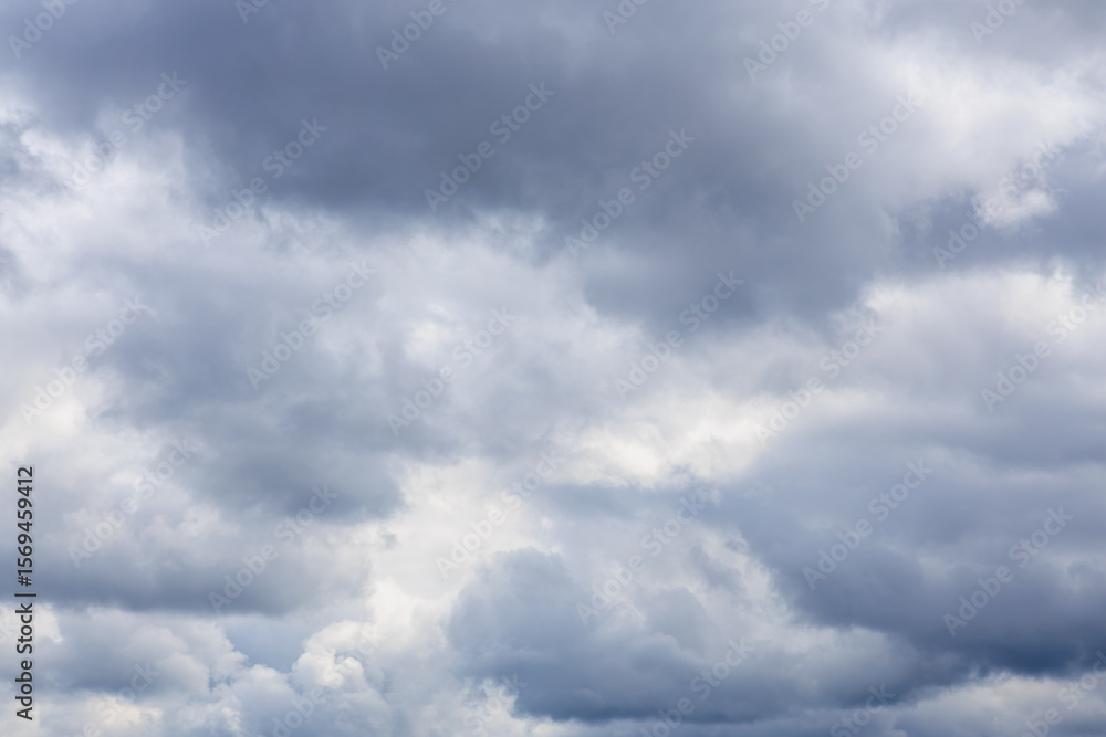Dramatic overcast sky with thick gray clouds at daytime Dramatic overcast sky with thick gray clouds at daytime