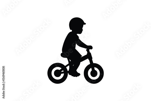 Silhouette of a child riding a balance bike with helmet