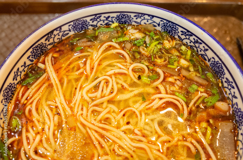 Lanzhou hand-pulled noodles served in blue and white porcelain bowl‌