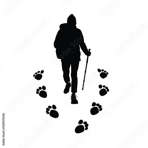 Black silhouette of hiker with snowshoe footprints on white