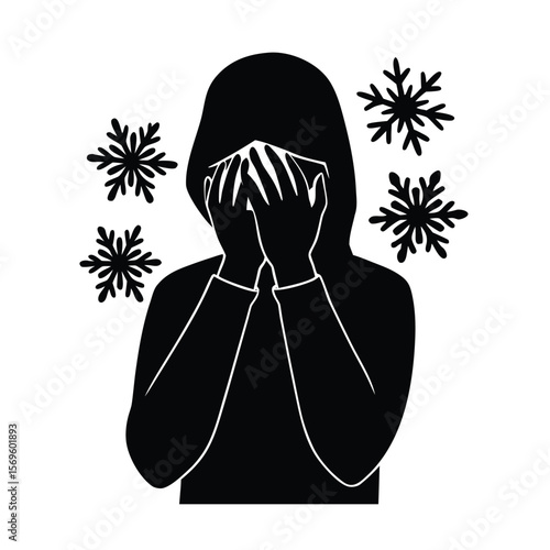 Silhouette person hiding face from falling snowflakes
