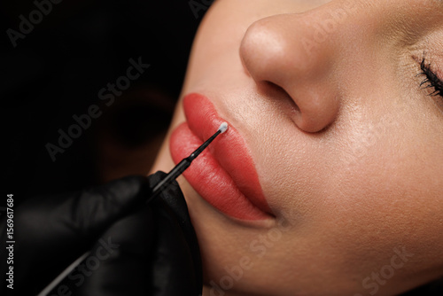 Фотография Macro of perfectly contoured pink lips with natural tone and smooth, healthy surrounding skin