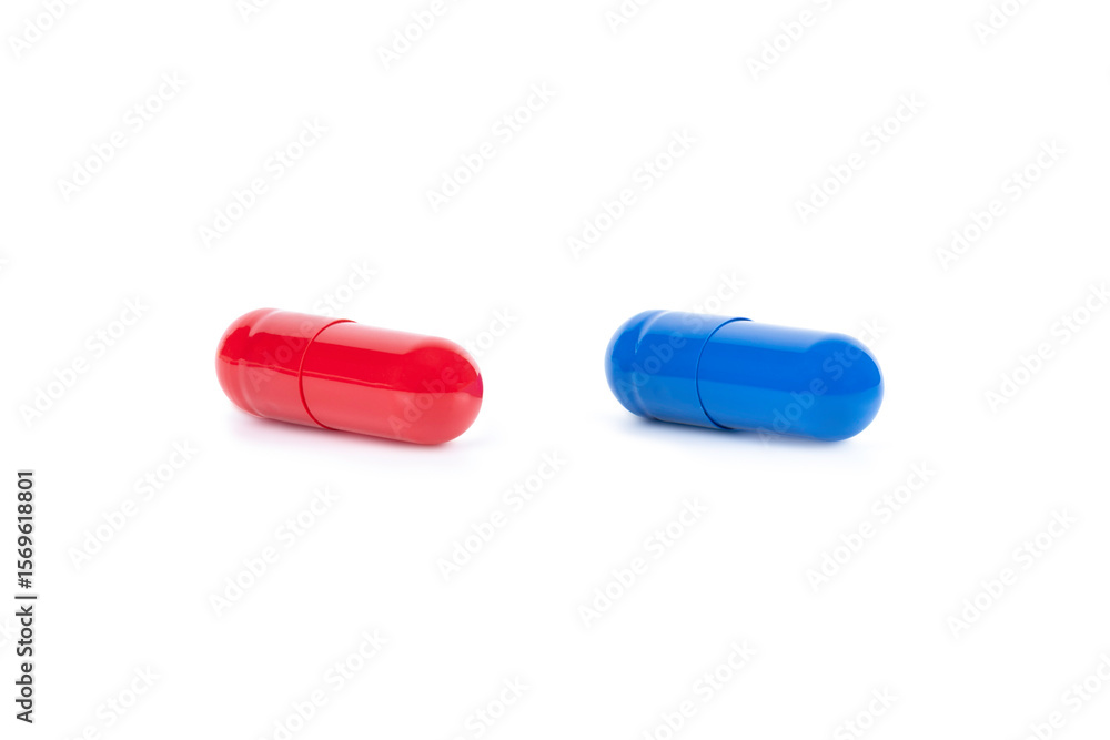 A red pill and a blue pill side by side, representing a difficult choice. A concept for a major decision, dilemma, and medicine, isolated on white background with clipping path. A red pill and a blue pill side by side, representing a difficult choice. A concept for a major decision, dilemma, and medicine, isolated on white background with clipping path.