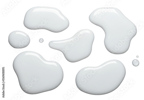 Several opaque white milk drops and puddles are isolated on transparent background