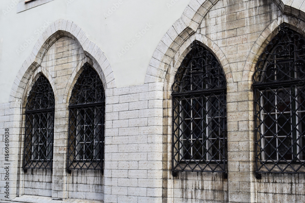 Naklejka premium Gothic Arch Windows with Wrought Iron Grates in Tallinn Old Town