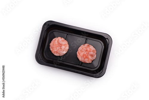Raw shrimps tartare on a black box on a white background