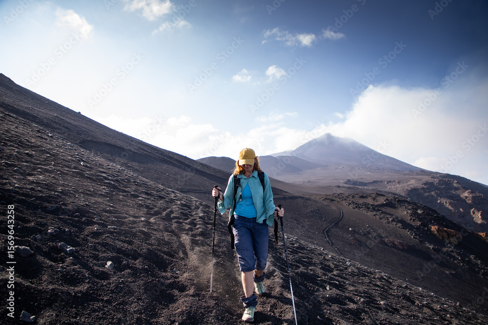 Fototapeta premium hiker trekking on mount Etna