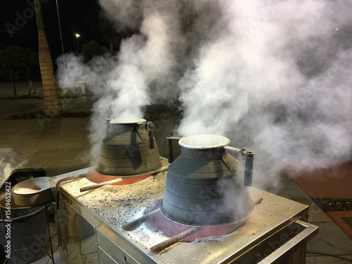 Chestnut roasting in Funchal , Madeira . Part of the Christmas festivities	