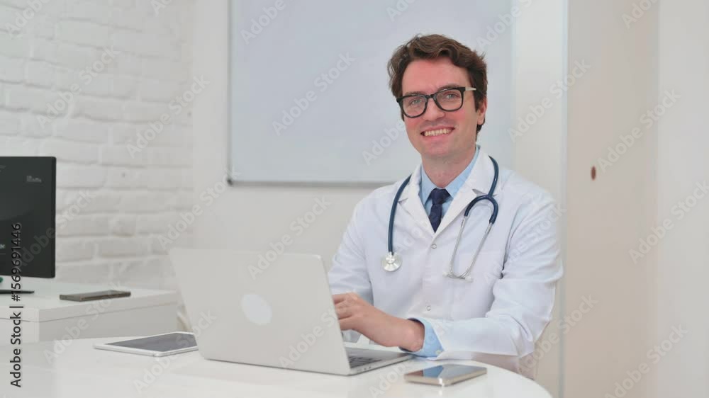 Mature Adult Doctor Smiling at Camera in Clinic Mature Adult Doctor Smiling at Camera in Clinic