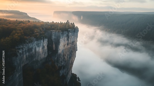 Majestic Cliff Overlooking Foggy Valley Sunrise