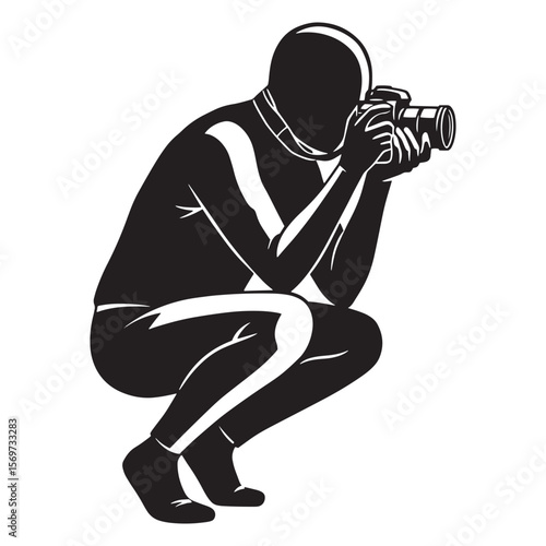 Photographer crouching down taking a photo with a professional dslr camera silhouette