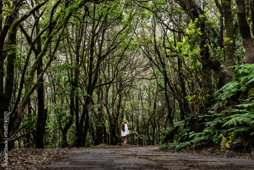 Tourist walking in garajonay national park exploring la gomera, canary islands, spain