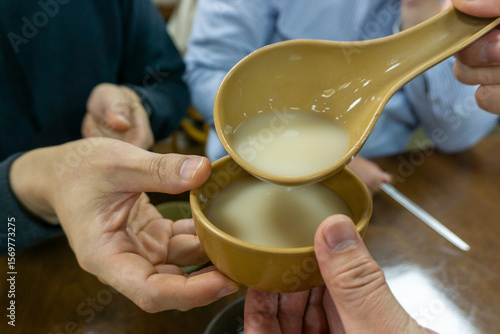 Rice Wine,Korean traditional liquor made from rice. Pouring makgeolli: traditional korean rice wine ceremony and culture concept