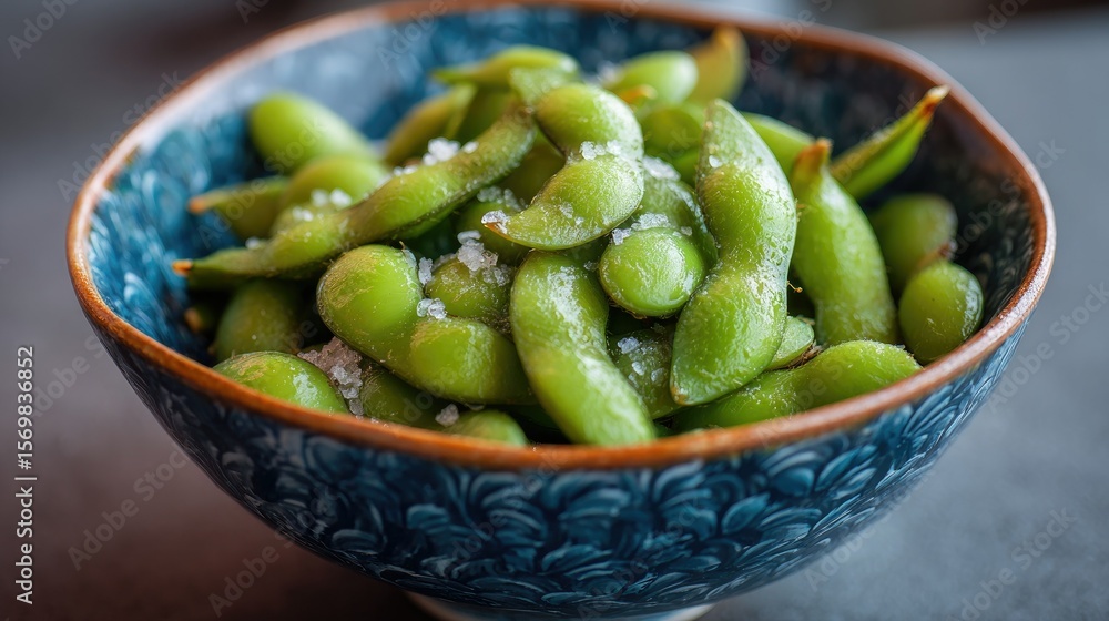 Roasted edamame in a blue bowl Roasted edamame in a blue bowl