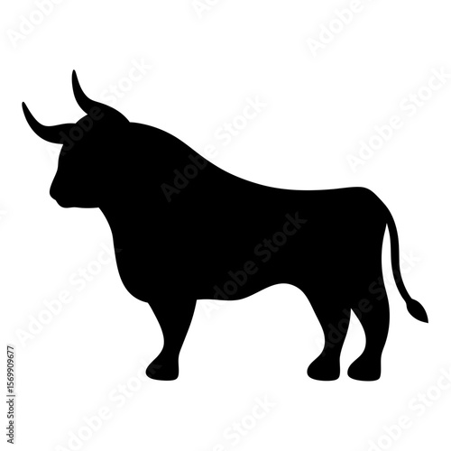 Silhouette of a powerful bull with prominent horns standing majestically