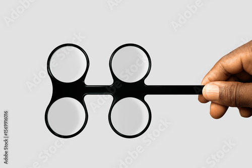 Fototapeta Black african Hand holding Accommodative flippers lenses for flipper rock eye ex