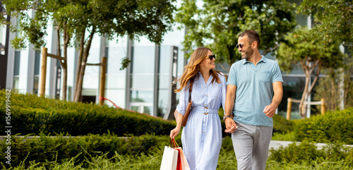 Couple strolls hand in hand...